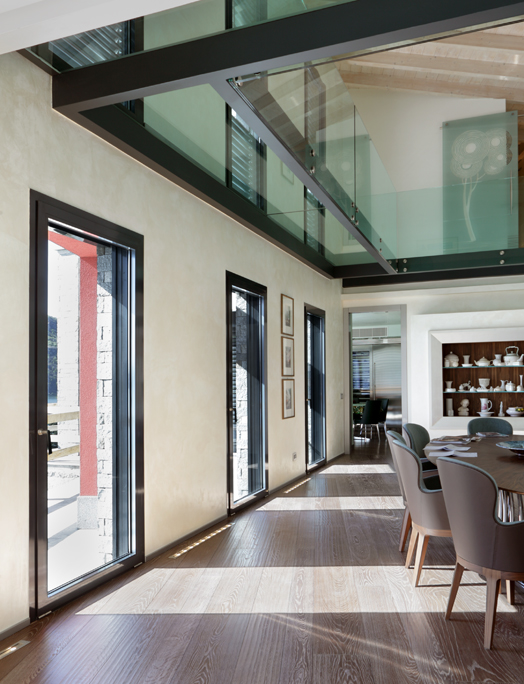 Room with windows and glass floor.