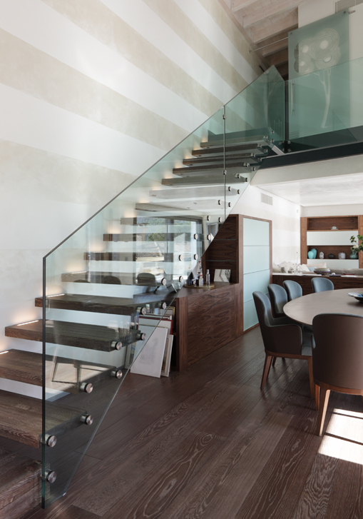 Staircase with glass railings.