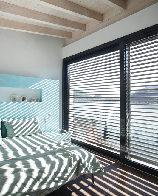 Room with window and lowered brise-soleil.