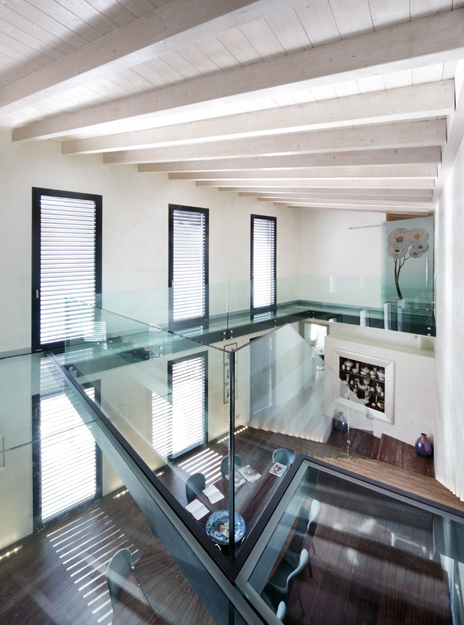 House with windows and glass railing.